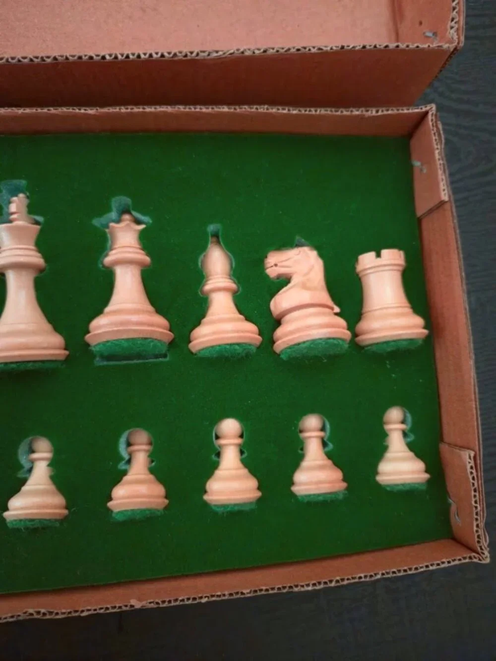 Vintage / new in holder. 17 piece wooden chess set with felt bottoms.